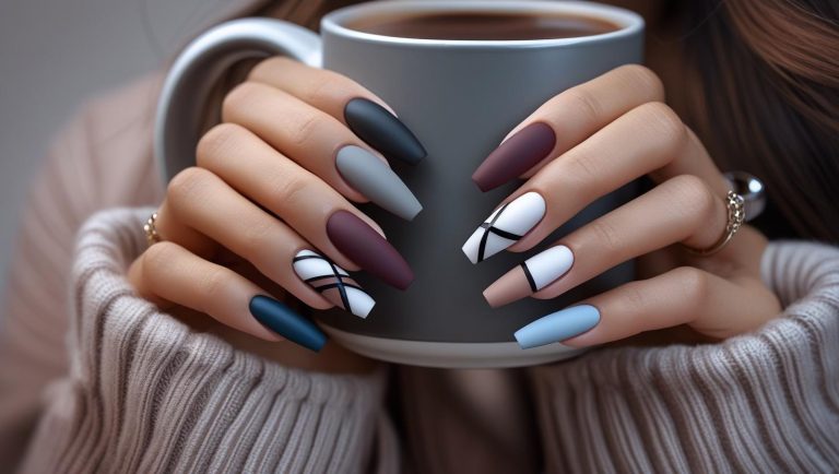 Close-up of matte finish nails in stylish colors with minimal designs, styled for a modern and elegant look.