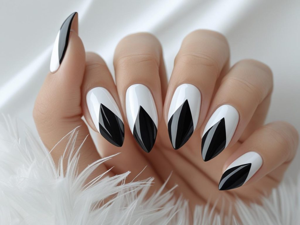  “Geometric accent easy nail designs with black triangles on nude.”