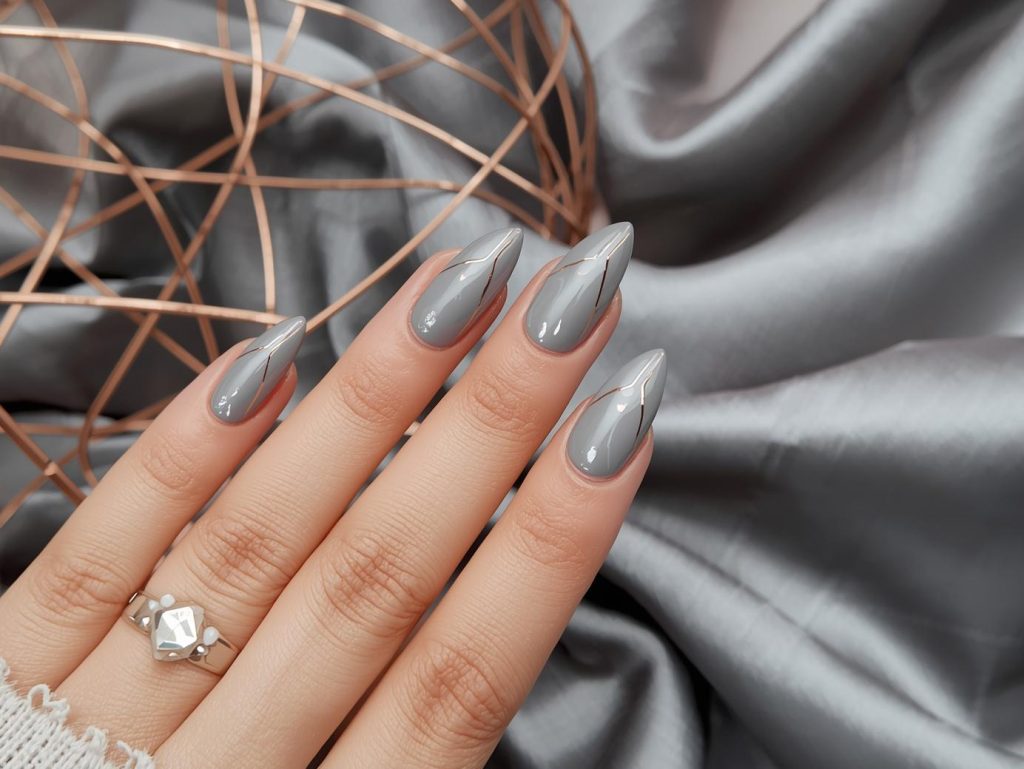 Glossy grey rose gold geometric nail art with glossy finish.