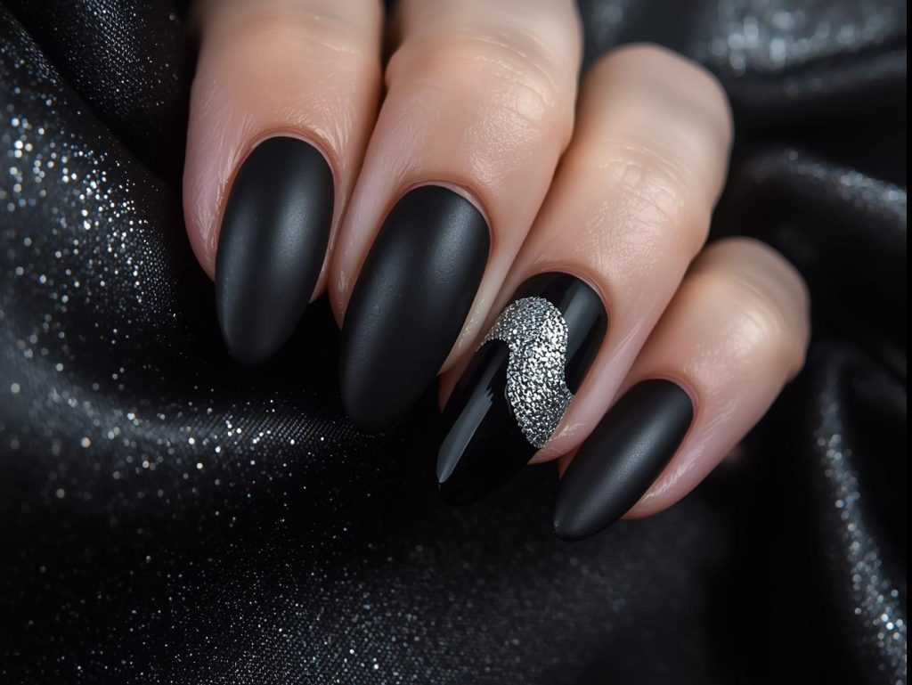 Bold black silver glitter wave accent nail art.