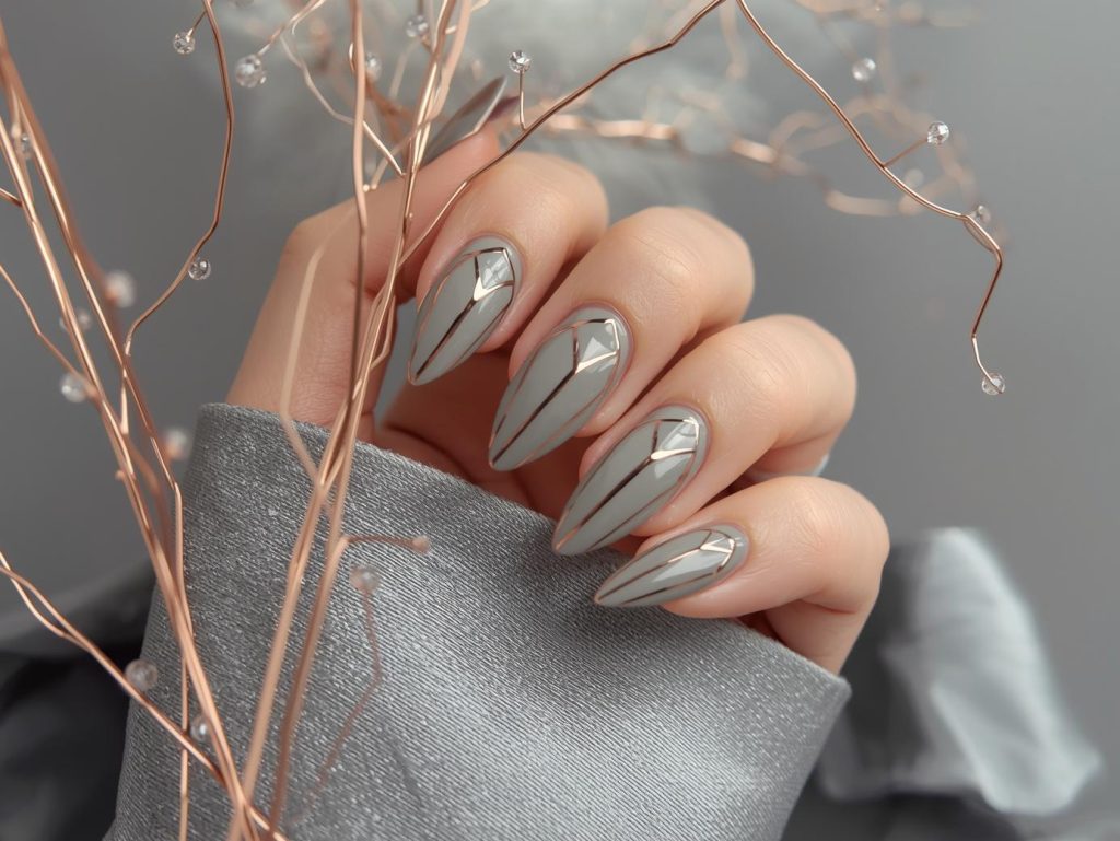 Creating glossy grey rose gold geometric nail art with rose gold polish.