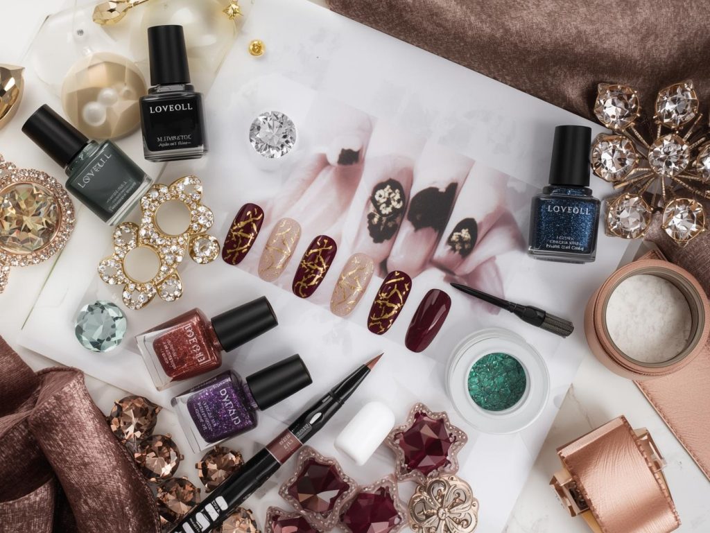 Nail art kit with polish and tools for luxury nail designs.