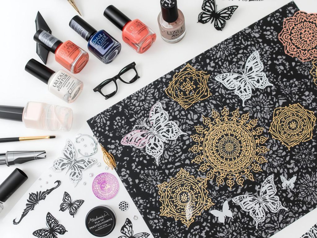 Nail art kit with polish and tools for nail decal designs.
