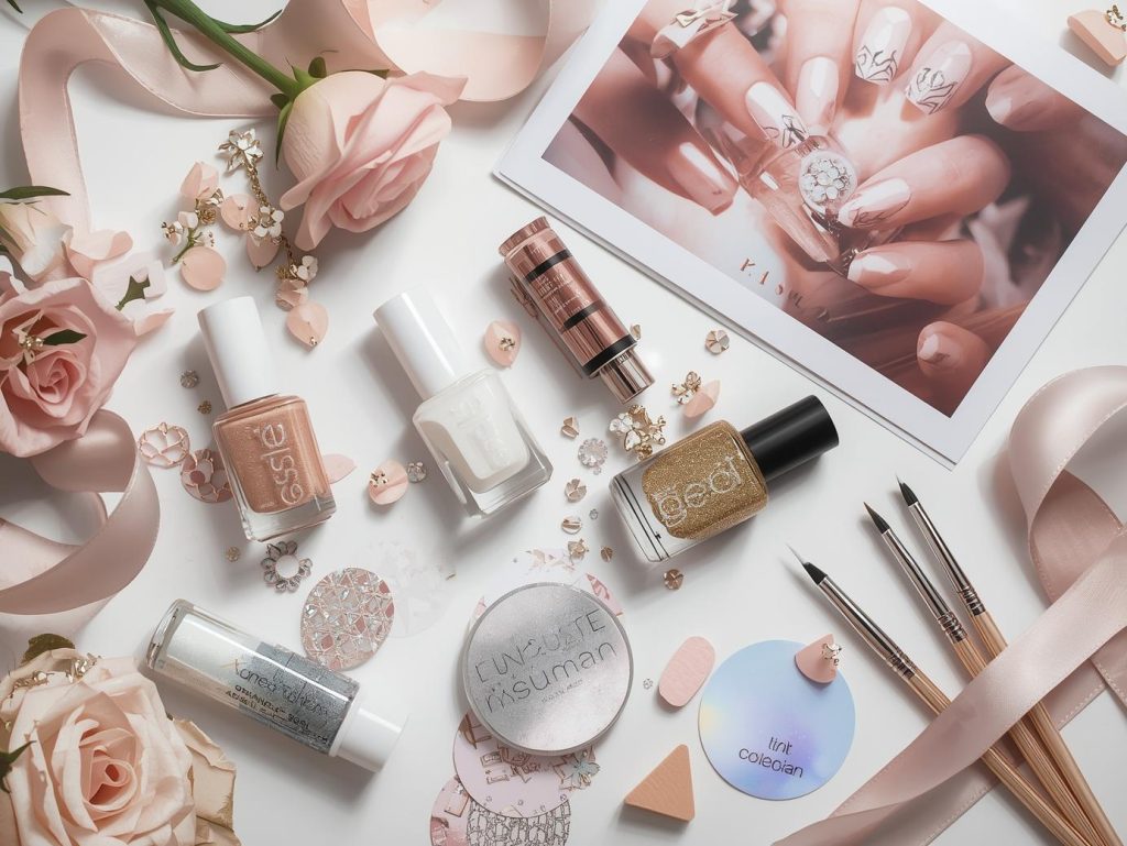 Nail art kit with polish and tools for rose gold nail designs.