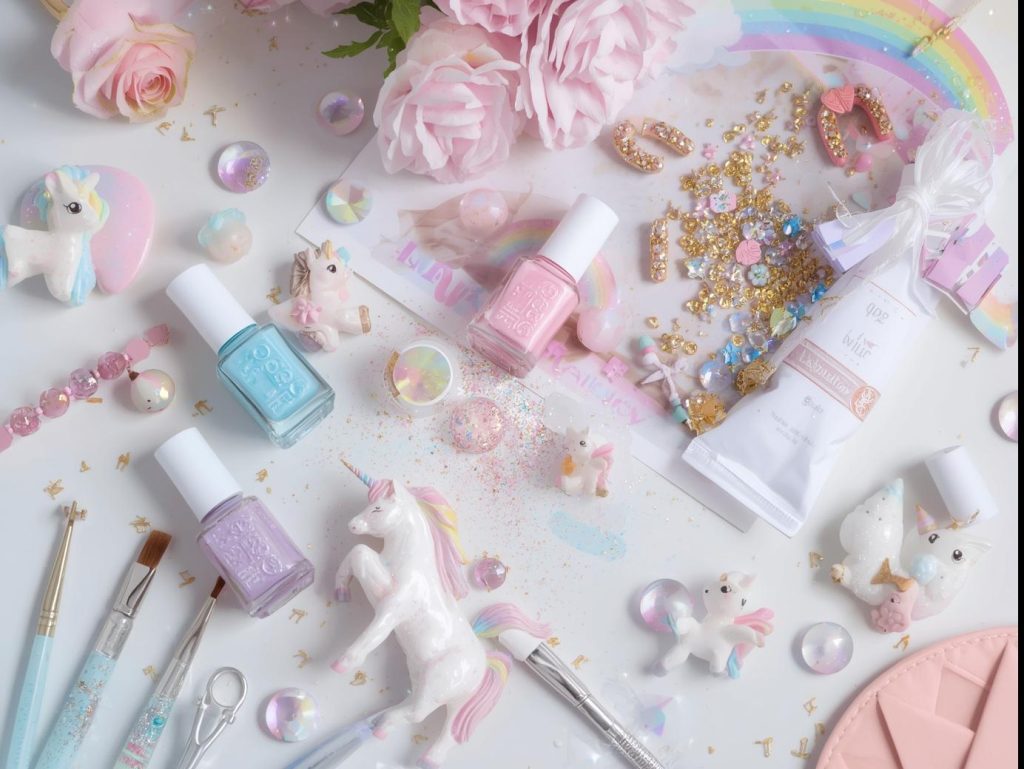  Nail art kit with polish and tools for unicorn nail designs.