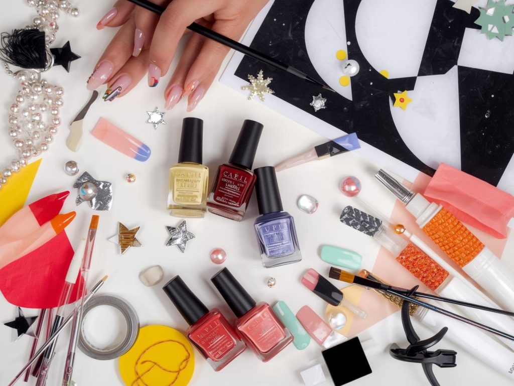 Nail art kit with polish and tools for color block nail designs.