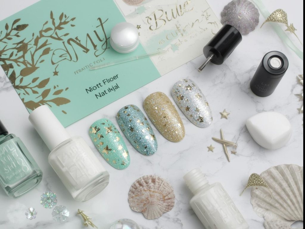 Nail art kit with polish and tools for mint green nail designs.