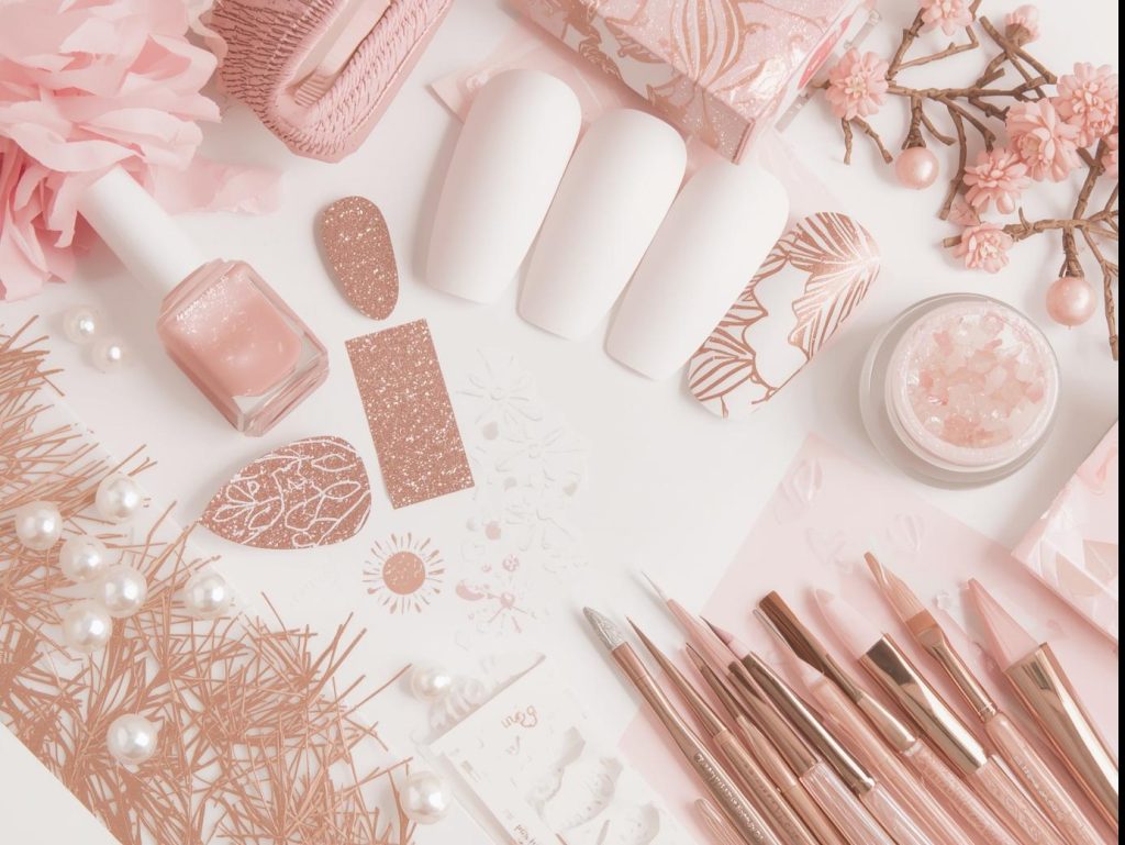  Nail art kit with polish and tools for blush nail designs.