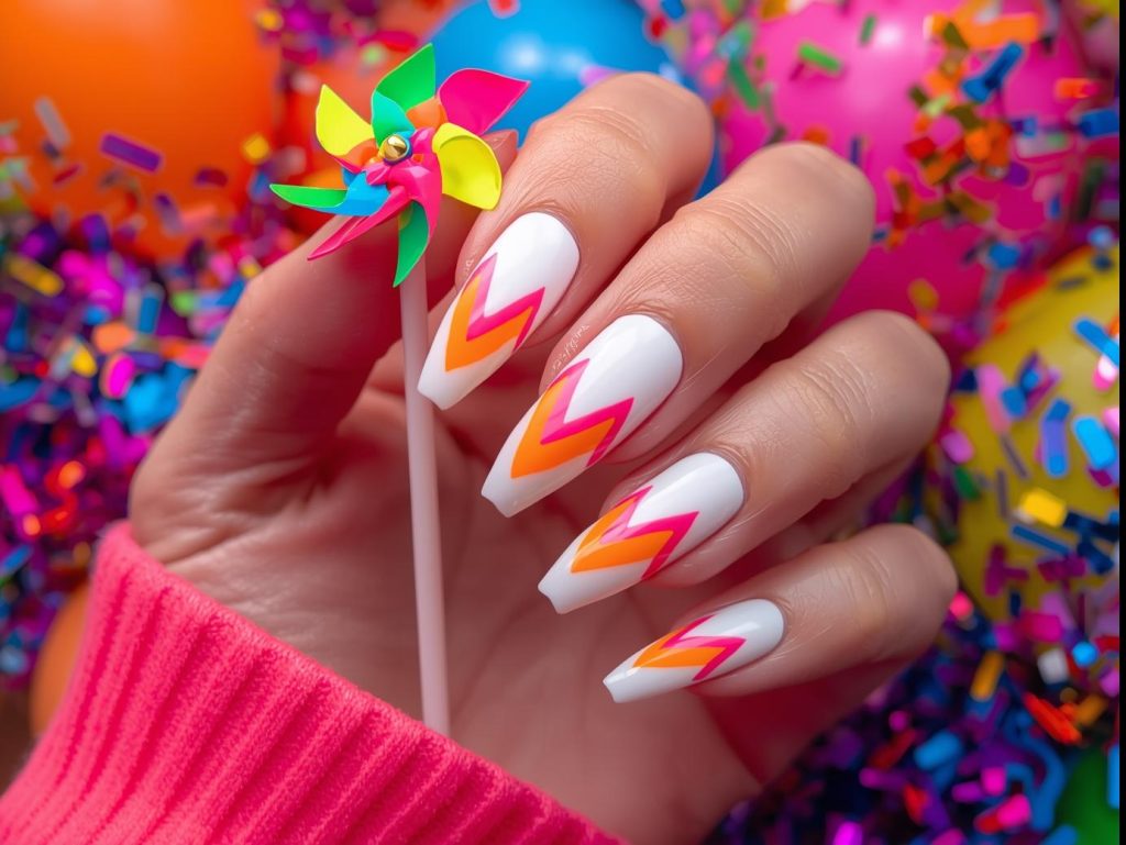 Colorful Nail Designs: Vibrant and Pinterest-Worthy Manicures to Obsess Over 3 Bold neon rainbow chevron colorful nail design with glossy white base on a Pinterest board.