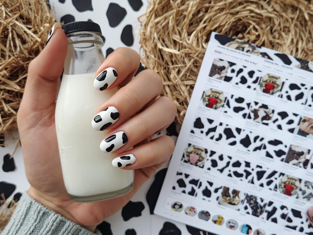 Cow Print Nail Designs: Playful and Pinterest-Worthy Manicures to Adore 3 Glossy white black cow nail design with white base on a Pinterest board.