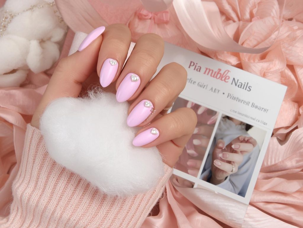 Soft Girl Nail Designs: Dreamy and Pinterest-Worthy Manicures to Adore 3 Pastel pink pearl heart nail design with pastel pink base on a Pinterest board.