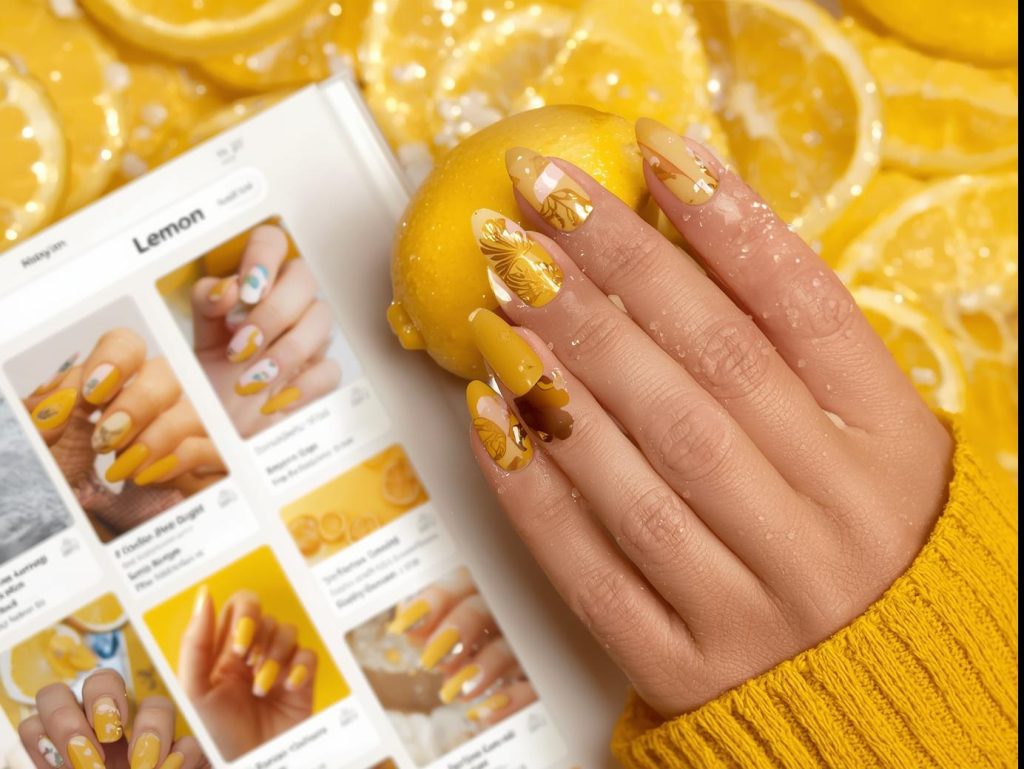 Bright lemon yellow gold foil citrus slice nail design with lemon yellow base on a Pinterest board.