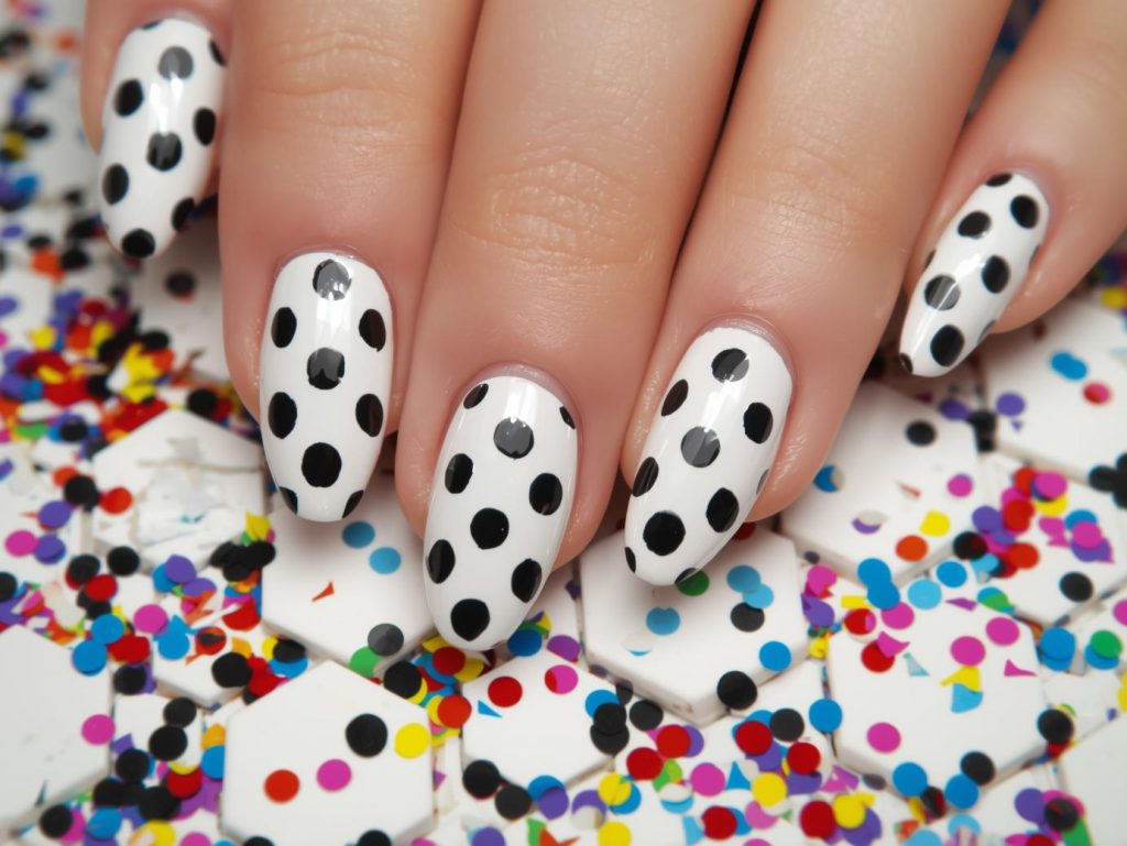  Glossy white black polka dot nail art with white base.