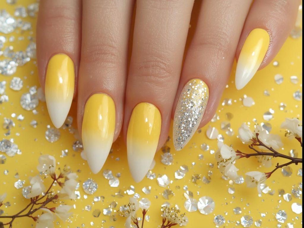 Lemon yellow ombre nail art with silver glitter sparkle accents.