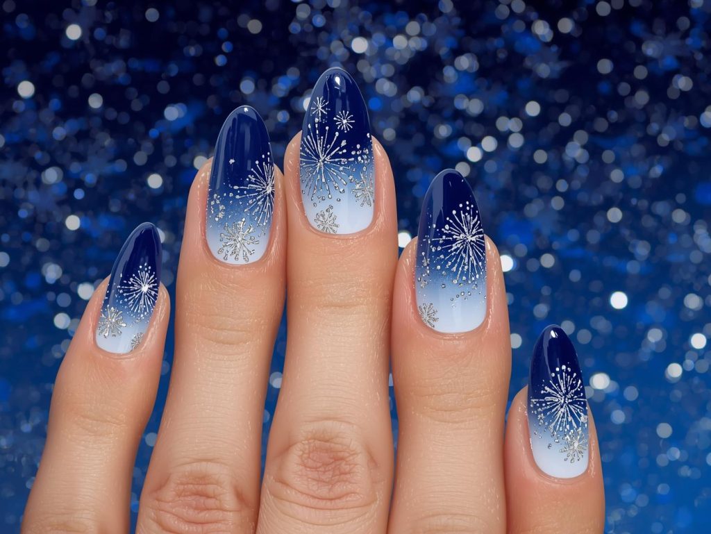 Navy blue ombre silver firework nail art with silver details.