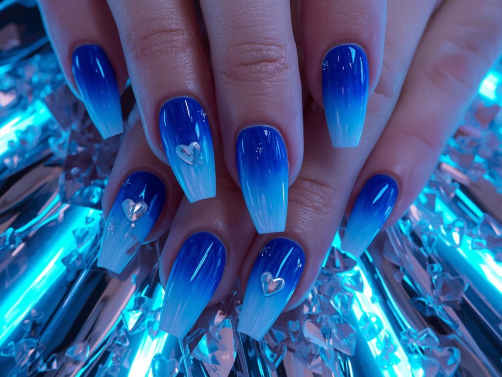  Electric blue ombre nail art with silver chrome heart accents.