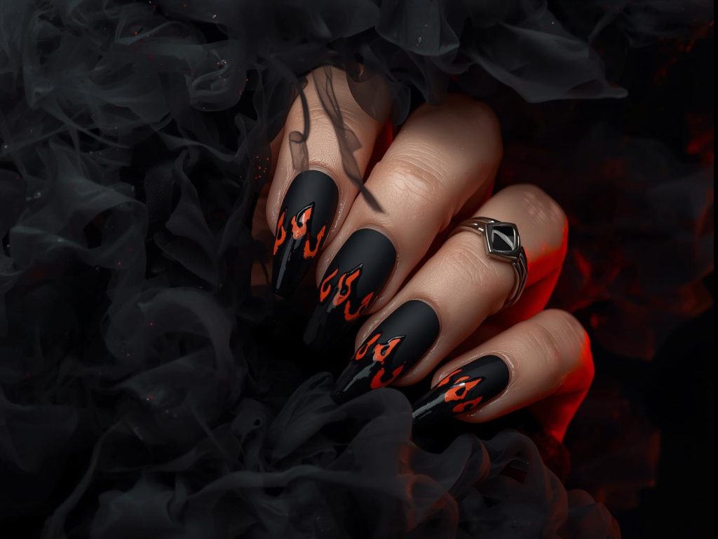 Matte black glossy flame nail art with glossy black details.