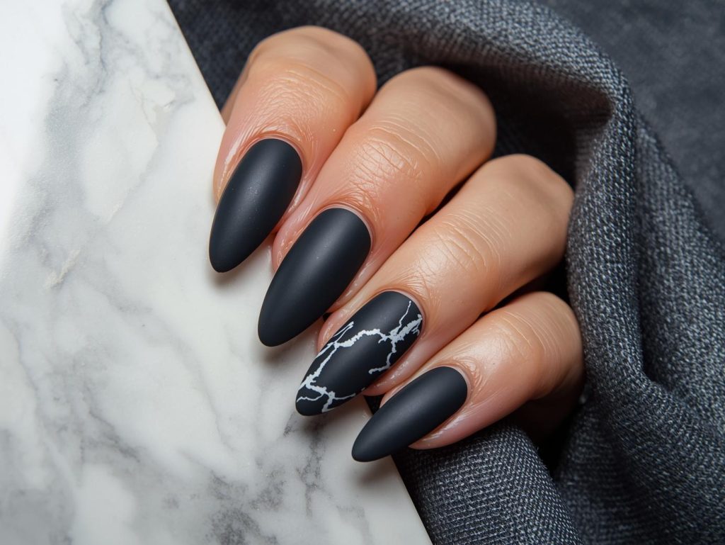 Deep charcoal white marble nail art with white patterns.