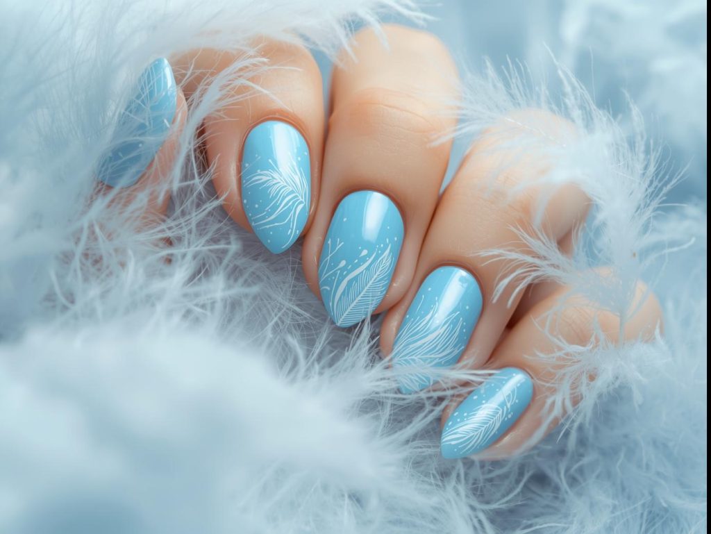 Sky Blue Nail Designs: Serene and Pinterest-Worthy Manicures to Adore 9 Vibrant sky blue feather nail art with white patterns.