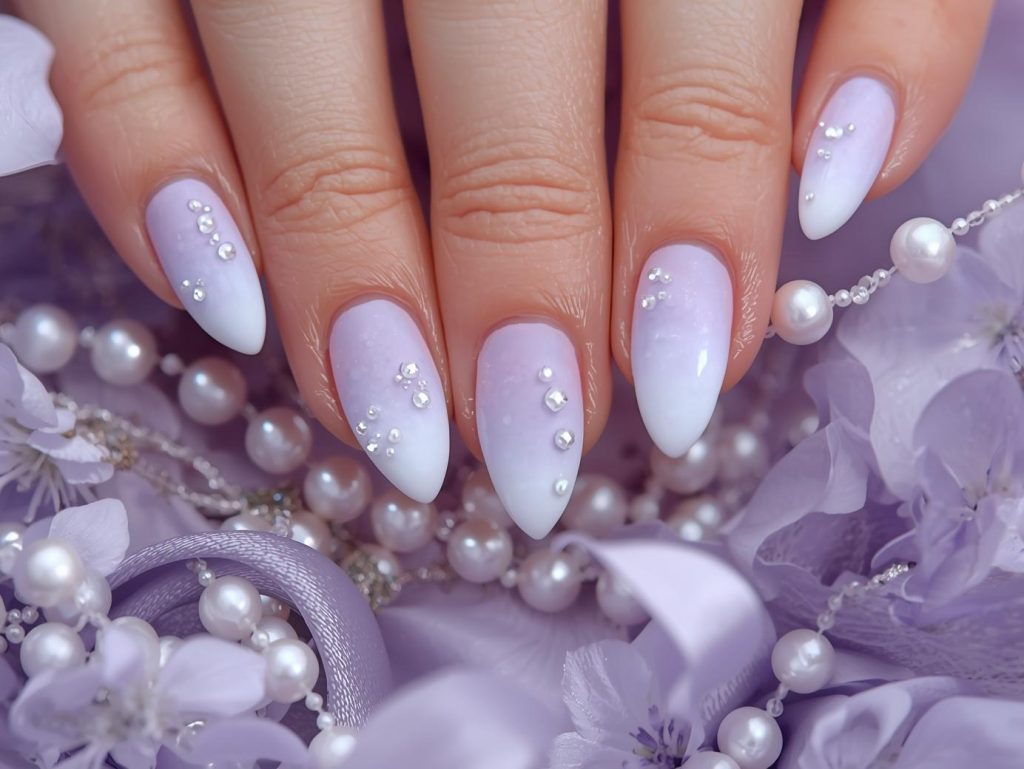 Soft lavender ombre nail art with pearl details.