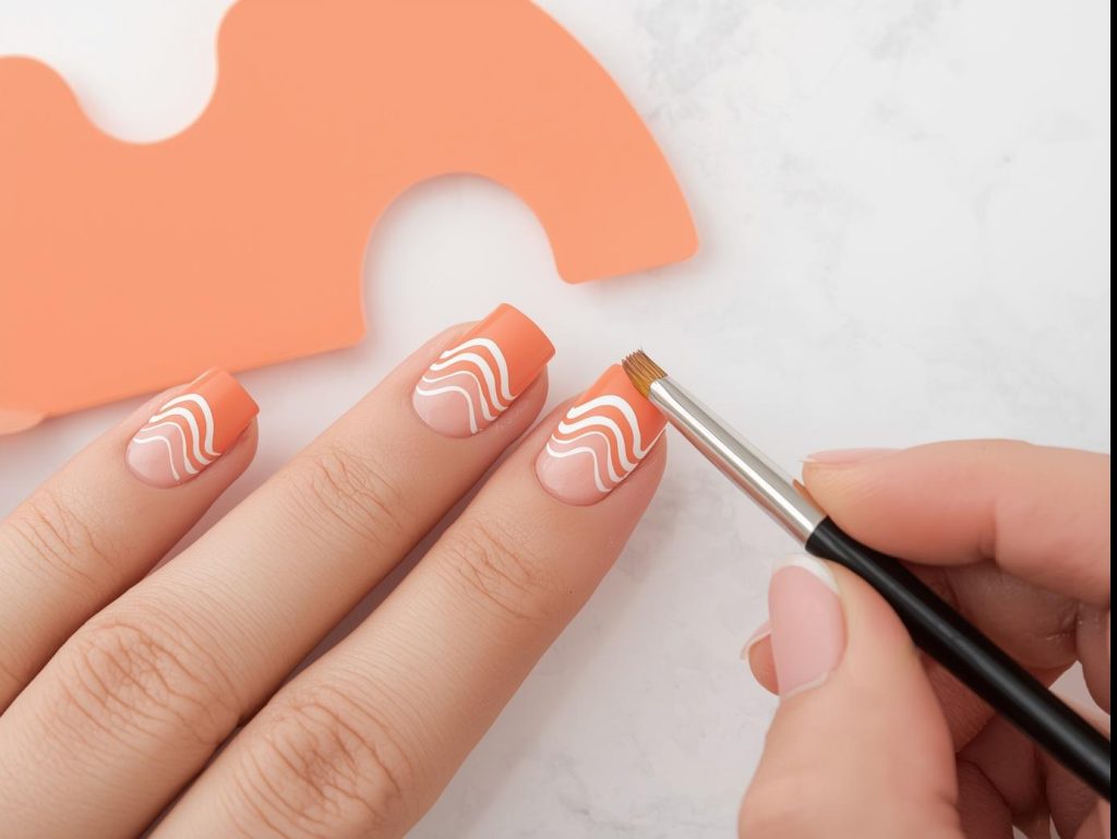 Creating vibrant peach geometric wave nail art with white patterns.