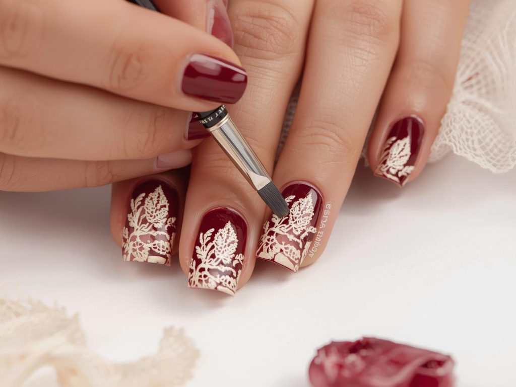  Creating rich burgundy creamy beige lace nail art with beige patterns.

