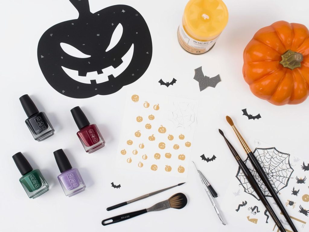Simple Halloween nail kit with polish and tools for quick spooky designs.