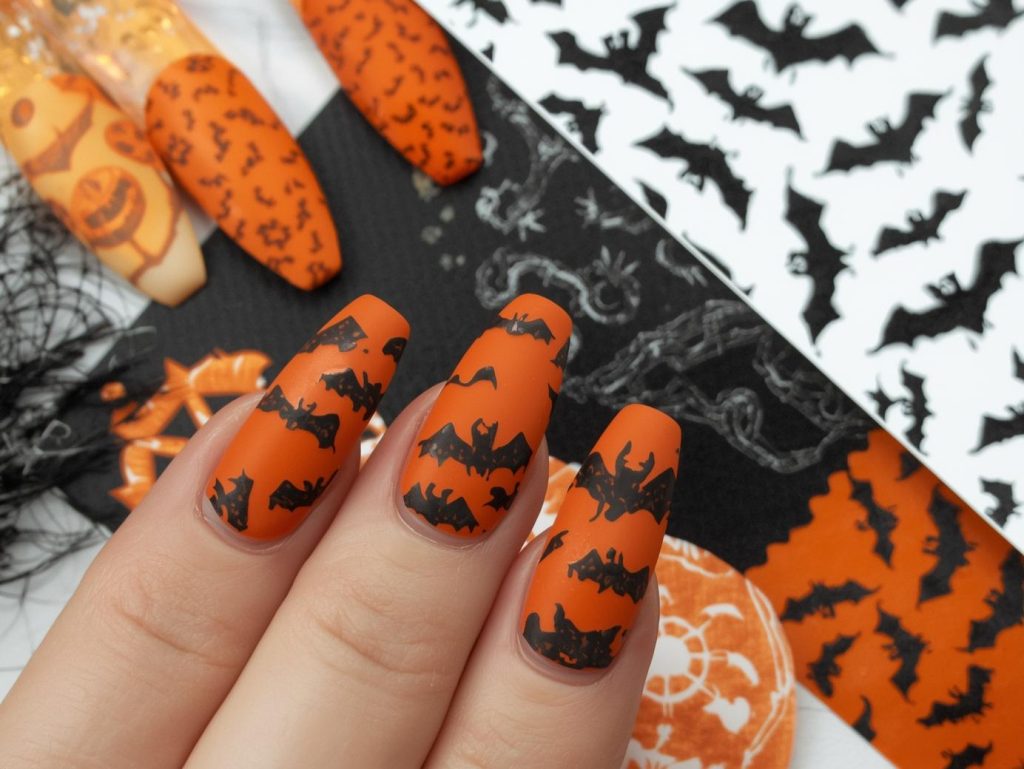  Matte orange black bat Halloween nail stickers with black decals.