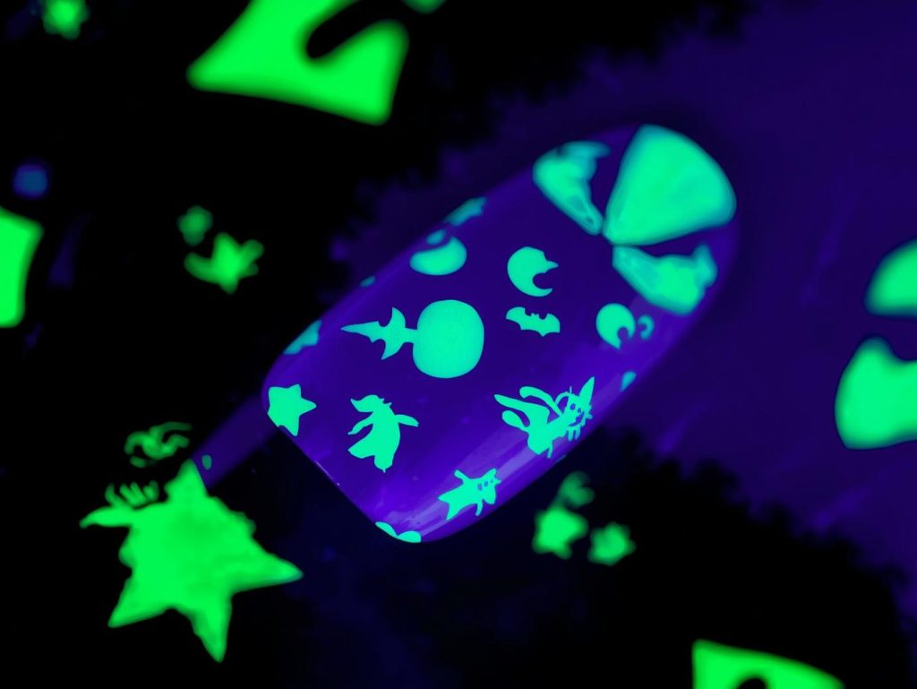  Deep purple glow-in-the-dark witch Halloween nail stickers with witch designs.