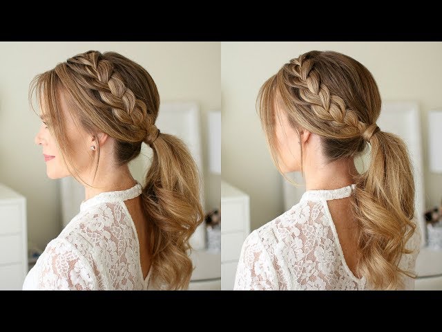 Sleek ponytail with a small braid accent adding stylish texture.